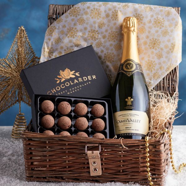 Champagne Truffles Hamper with bottle of Camel Valley Brut sparkling wine and box of Chocolarder Salted Caramel truffles in gift presentation.