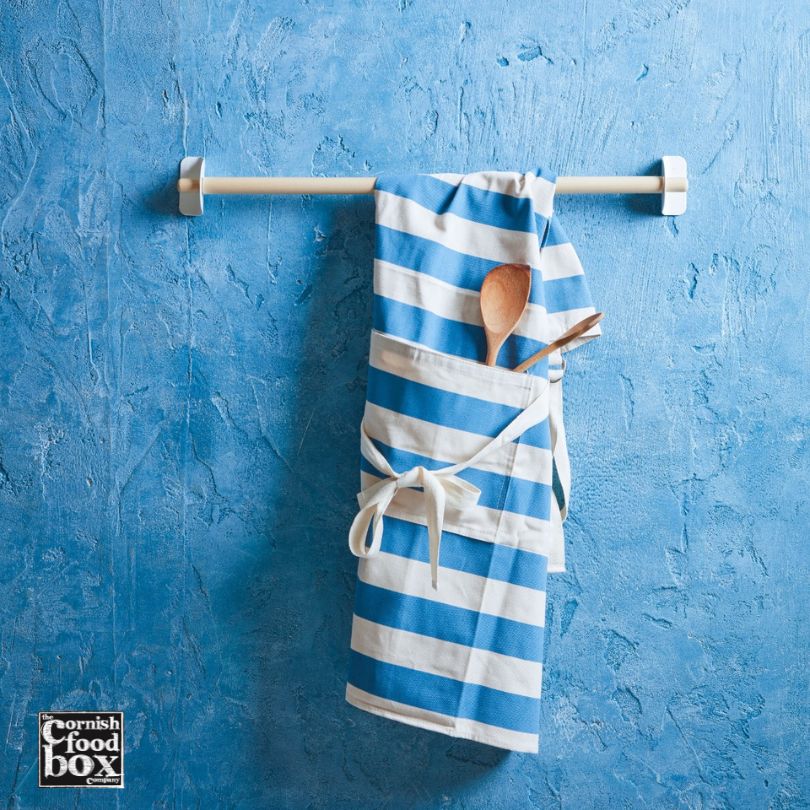 Cornishware Blue and White Stripy Apron on blue background