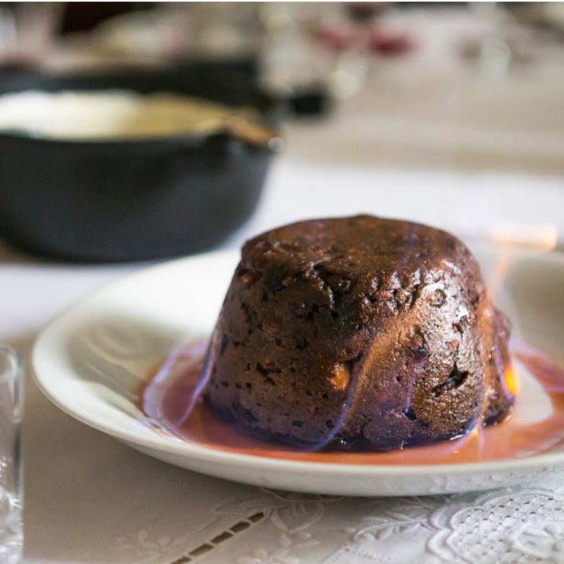 Honeys Cornish Christmas pudding, a traditional Victorian recipe handmade in Cornwall, served with clotted cream
