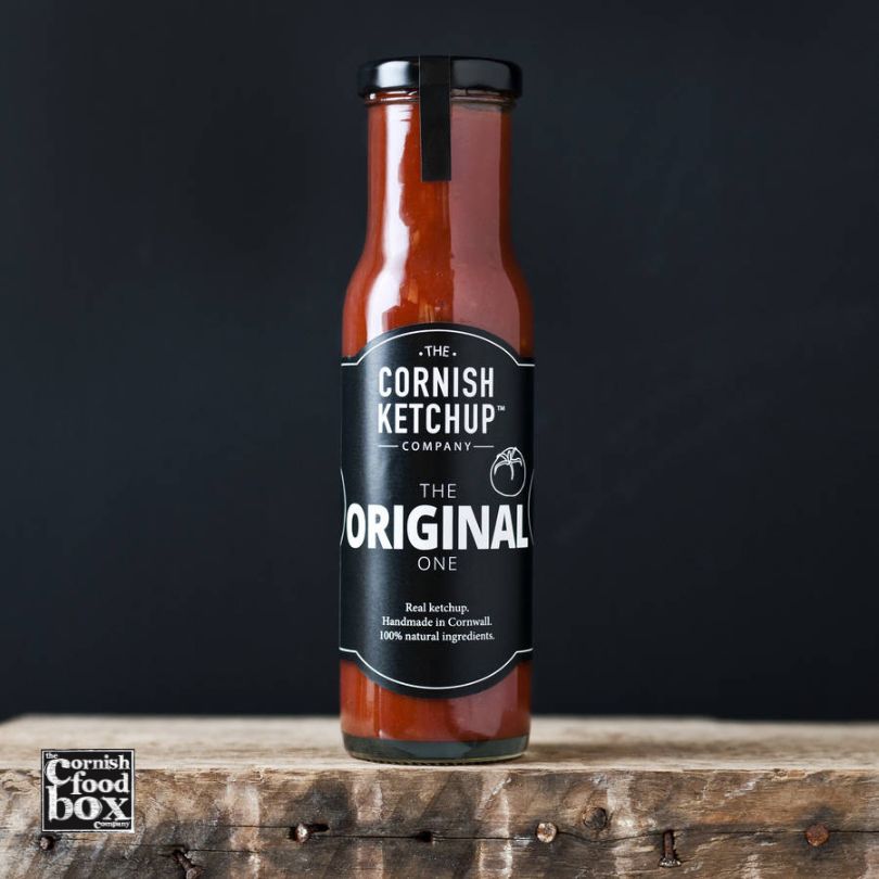 Cornish Ketchup bottle featuring a rich red tomato-based sauce with a glossy finish, labeled with 'The Cornish Ketchup Company' branding. Amazing artisan red sauce which is better than Heinz